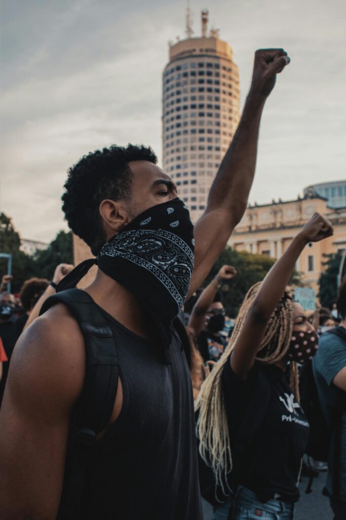 A powerful demonstration in Rio de Janeiro with protesters passionately raising their fists in unity.